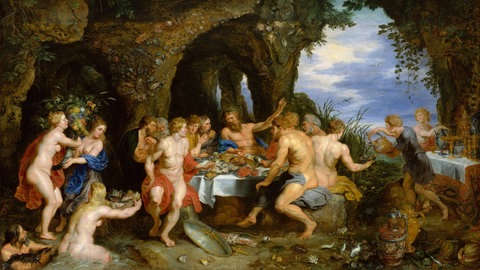 Gesellschaft an einem gedeckten Tisch