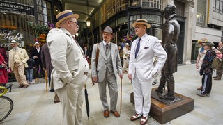 British eccentrics at the Beau Brummell statue on Jermyn Street. London.