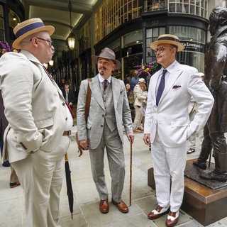 British eccentrics at the Beau Brummell statue on Jermyn Street. London.