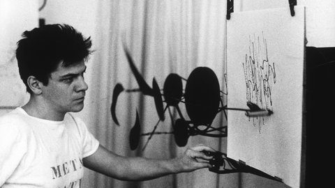 Jean Tinguely mit seiner Malmaschine Méta-Matic.