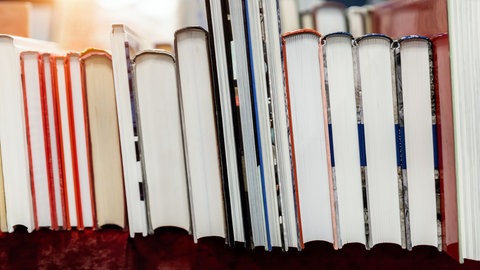 Row of old aged books at flea market