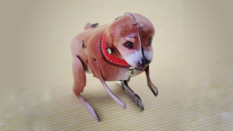 historischer Spielzeughund aus Blech; Illustration für das Gedicht "Der Rückwärtssalto-Hund auf Weihnachtsmärkten" von Clemens Setz