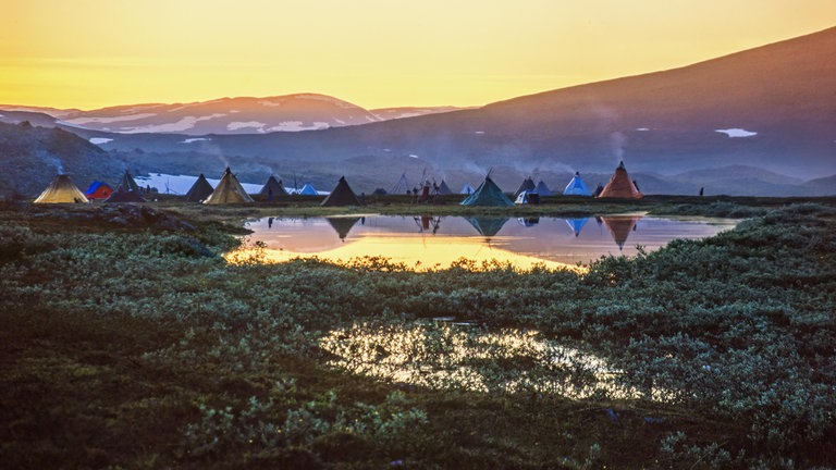 Tent settlement for reindeer herders in the midnight sun at the north of Sweden