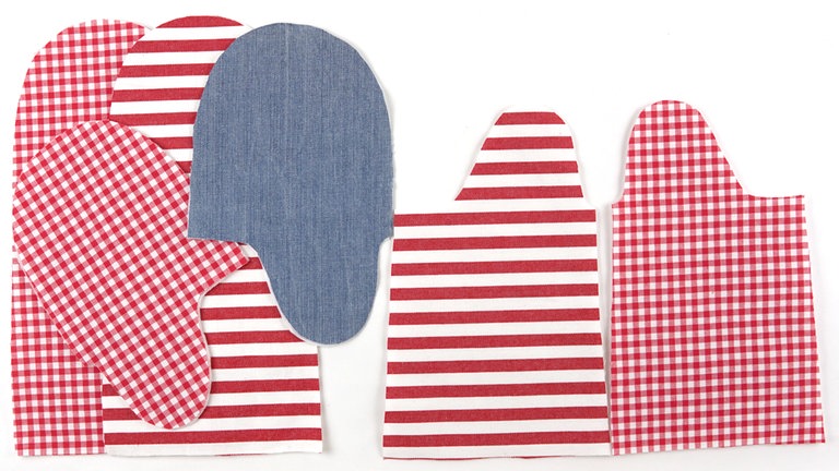 Das Außenseitenteil aus Thermolam bündig auf die linke Stoffseite der Außenseite aus Oberstoff legen (an der Eingriffkante steht der Oberstoff 1 cm über). Nach Wunsch eine Applikation, Ziernähte oder ein Band aufnähen.