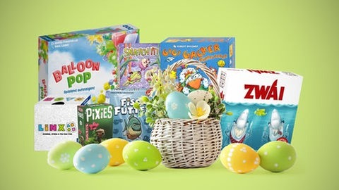 Sieben kleine Gesellschaftsspiele mit einem Nest und Ostereiern: So manches aktuelles Brettspiel, Kartenspiel und Würfelspiel eignet sich gut als Geschenk zu Ostern.
