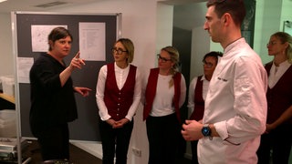 Besprechung eines Catering-Teams