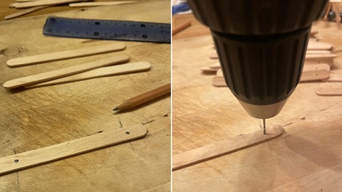 Lüöcher werden auf Holzstab angezeichnet und gebohrt