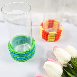Vasen-Upcycling aus bunten Garnresten