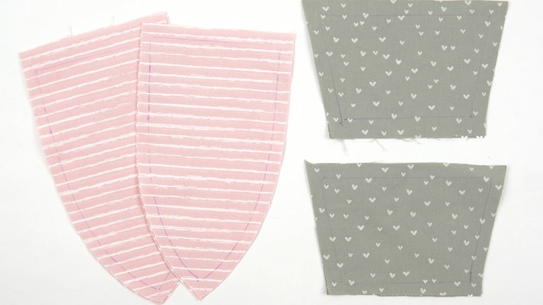 Die Schnittteile wie angegeben zuschneiden und die Markierungen vom Schnittmuster auf die Stoffteile übertragen.