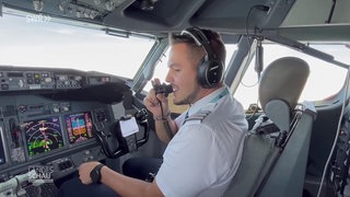 Pilot macht eine Durchsage