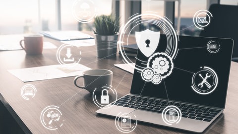 Notebook mit grafischen Elementen zum Thema Sicherheit