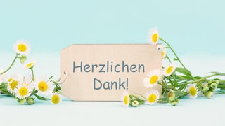 Herzlichen Dank umrahmt von Blumen