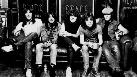 Mid 1980s photo of rock band, ACDC: l-r: Cliff Williams (bass), Malcolm Young (guitsr), Simon Wright (drums), Angus Young (guitar) and Brian Johnson (vocals).