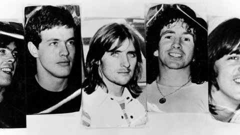 Late 1970s photo of rock band, ACDC: l-r: Cliff Williams (bass), Angus Young (guitar), Phil Rudd (drums), Bon Scott (vocals) and Malcolm Young (guitar).