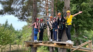 Laura Zacharias mit den Gewinnern des perfekten Tages