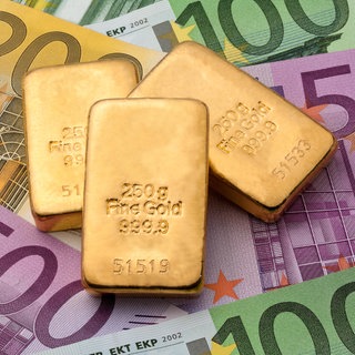 Geldanlage in echtem Gold als Goldbarren und Goldmünzen.