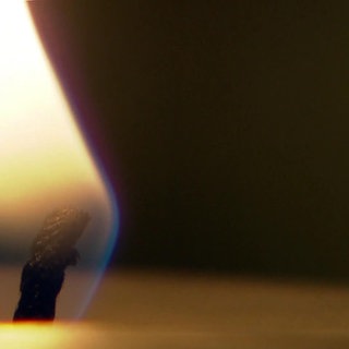 Brennender Kerzendocht