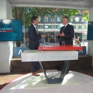 Nachrichtensprecher Sascha Becker mit CDU-Chef Gordon Schnieder