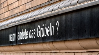 Schriftzug: Wann endete das Grübeln?