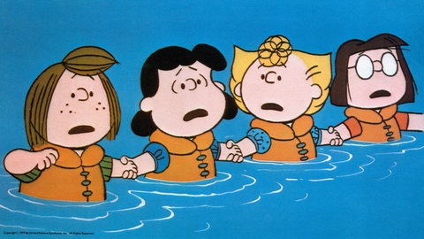 Peppermint Patty, Lucy, Sally und Marcie von den "Peanuts" stehen, von Charles M. Schulz gezeichnet, mit Rettungswesten im Wasser und halten sich an den Händen: Viele Comig-Figuren haben nur vier Finger. Warum ist das so?