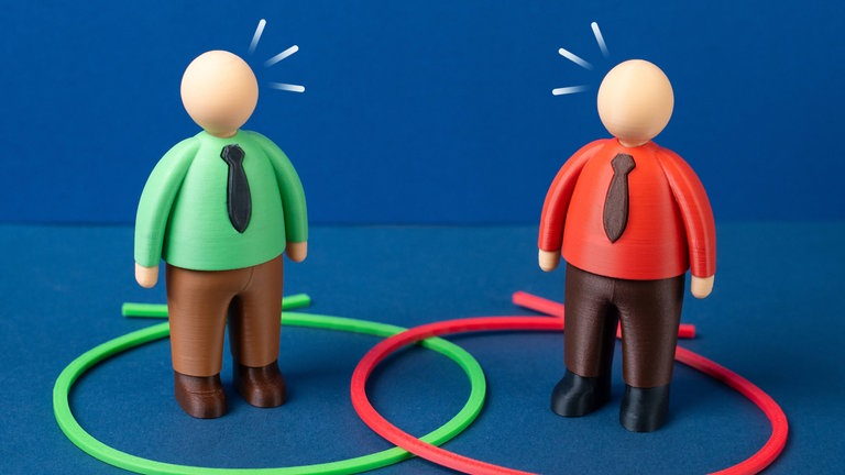 Zwei Figuren stehen jeweils in einem Kreis; die Kreise überlappen sich und bilden eine Schnittmenge: Wir treffen jeden Tag Entscheidungen und gehen dabei Kompromisse ein. Doch nicht immer ist der Mittelweg der bessere Weg.