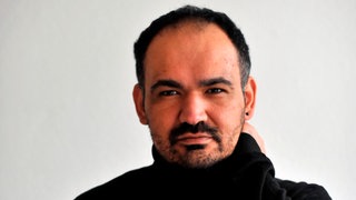 Porträt von Dincer Gücyeter