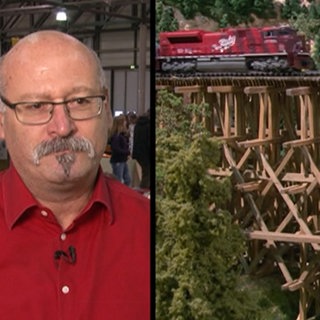 Männliche Person und Eisenbahn auf Brücke