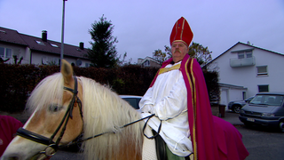 Gerhard als St. Martin auf seinem Pferd.