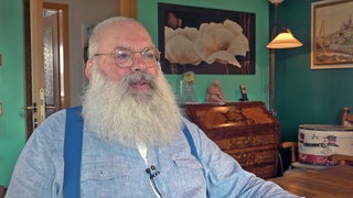 Der Rheinhesse Stefan Hofmeister ist mit seinem sibrig-weißen kreisrunden Vollbart schottischer Meister