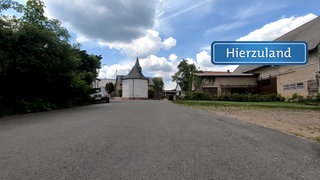 Hierzuland Flesten St. Rochus Straße Schild