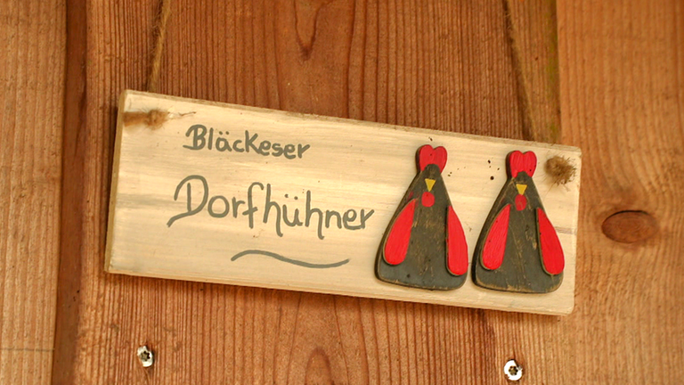 Schild "Bläckeser Dorfhühner"